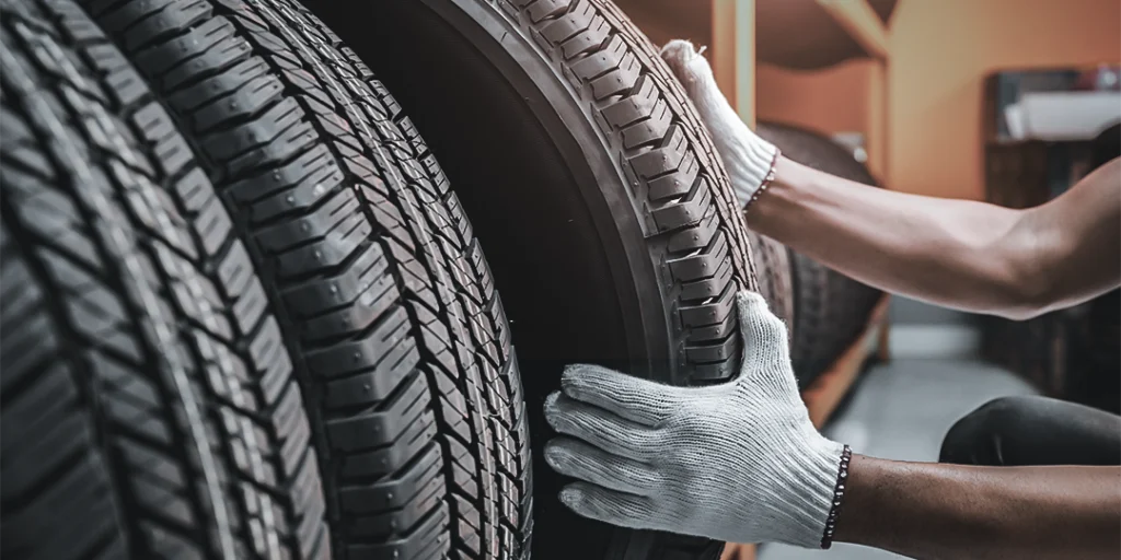 two hand holding tire